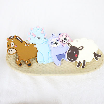 Ζωηρόχρωμη εξατομικευμένη μωρό σιλικόνη Teether με τη μορφή της Dino αλόγων προβάτων